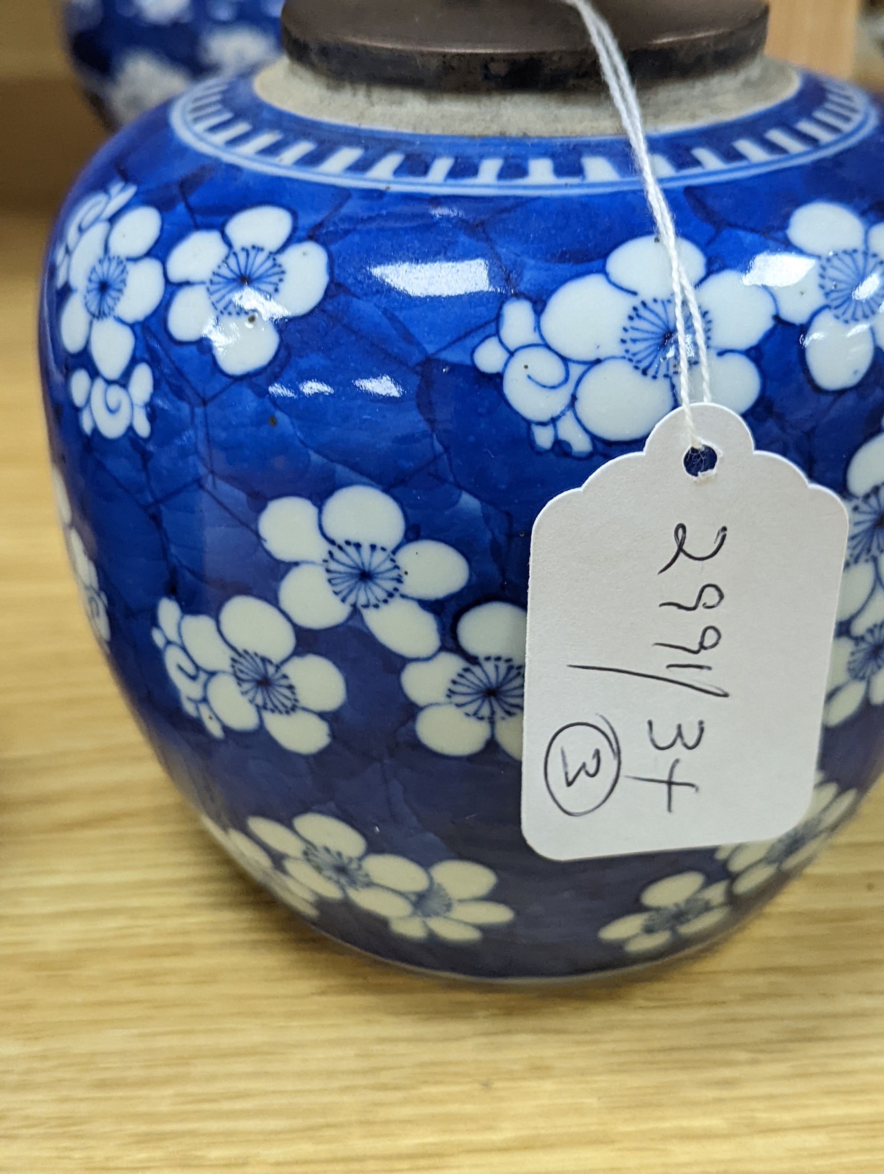 Three Chinese blue and white prunus decorated jars and covers, 19th/20th century, with four character marks 18cm